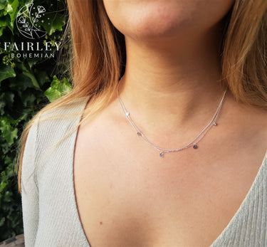 layering necklace on model